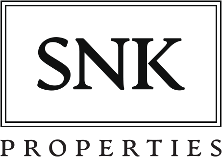 S N K Properties Logo